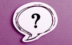 Question mark speech bubble isolated on purple background
