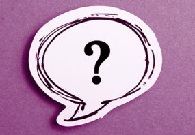 Question mark speech bubble isolated on purple background