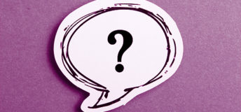 Question mark speech bubble isolated on purple background