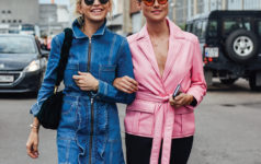 Two models walking down a road
