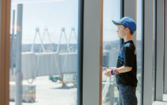 Boy looking through a window