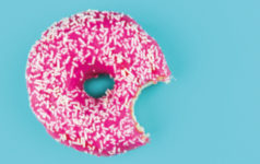 A donut with a bit taken out of it